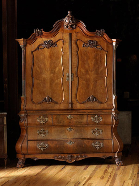 Dutch Walnut Armoire with Arched and Carved Crest Above a Pair of Shaped Paneled Doors.