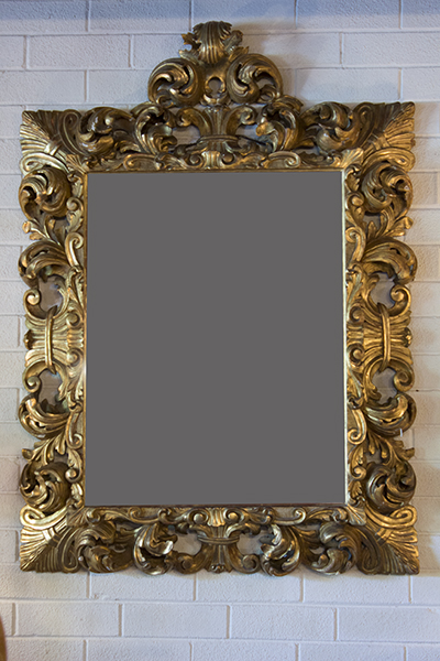 French Gilt Mirror Carved in Scrolls and Acanthus Leaves