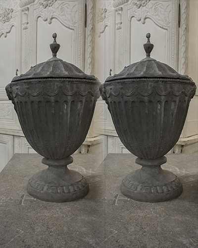 Pair of English 19th century neoclassical lead garden urns in the manner of Robert Adam