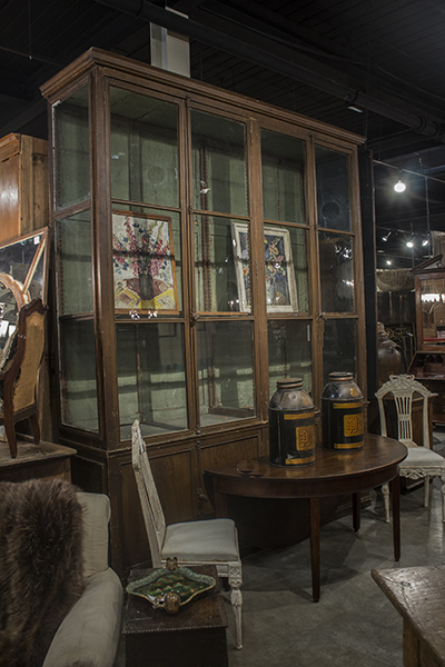 French display cabinet with glazed doors and sides above the lower doors