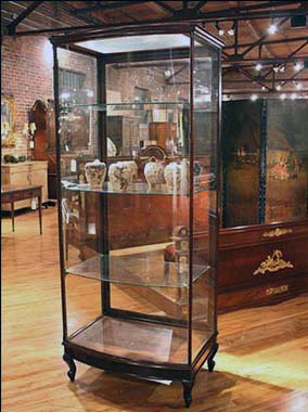 English Glass and Wood Display Cabinet with Shelves , One Large Door, Curved Front.